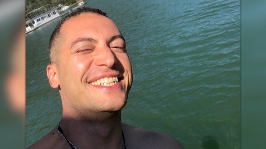 Nima Momeni selfie near water