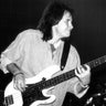 John Regan plays bass on stage at a concert
