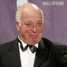 Seymour Stein holding his award after being inducted into the rock and roll hall of fame
