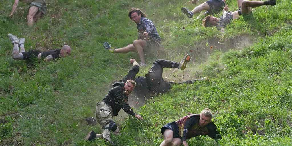 Hundreds gather for annual Cooper's Hill cheese-rolling race in southwest England - Vimarsana News