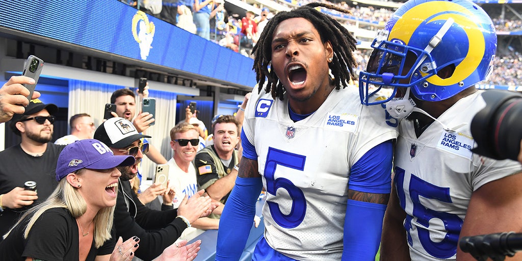 Los Angeles Rams defensive back Jalen Ramsey celebrates his interception in  the end zone in front