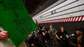 Protesters stand on the train tracks at the Lexington Ave/63rd Street subway station during a "Justice for Jordan Neely" protest that began outside the Broadway-Lafayette station on May 06, 2023 in New York City.