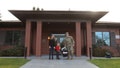 The Miller family stands outside the Army Fisher House, Joint Base Lewis-McChord at Madigan Army Medical Center in Tacoma, Washington.