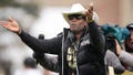 Colorado head coach Deion Sanders plays to the fans in the first half of the team's spring practice NCAA college football game Saturday, April 22, 2023, in Boulder, Colo.