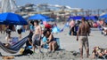 WILDWOOD, NJ - MAY 30: A couple embraces on the beach on May 30, 2022 in Wildwood, New Jersey. Memorial Day events are held across the U.S. to commemorate those who died in active military service.