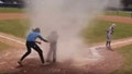 A 17-year-old umpire rushes to rescue a seven-year-old baseball player from a dust devil.