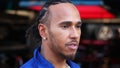 Lewis Hamilton of Great Britain and Mercedes looks on in the Paddock during previews ahead of the F1 Grand Prix of Miami at Miami International Autodrome on May 04, 2023 in Miami, Florida.