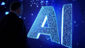A visitor watches an AI (Artificial Intelligence) sign on an animated screen at the Mobile World Congress (MWC), the telecom industry's biggest annual gathering, in Barcelona. - Fox News