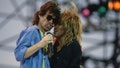 Mick Jagger, singer for the Rolling Stones, and singer Tina Turner sing together at the Live Aid benefit concert. Live Aid is a benefit concert to provide relief for famine victims in Ethiopia.   (Photo by Lynn Goldsmith/Corbis/VCG via Getty Images)
