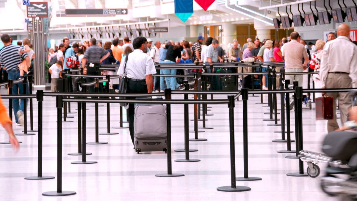 People waiting at the TSA line.