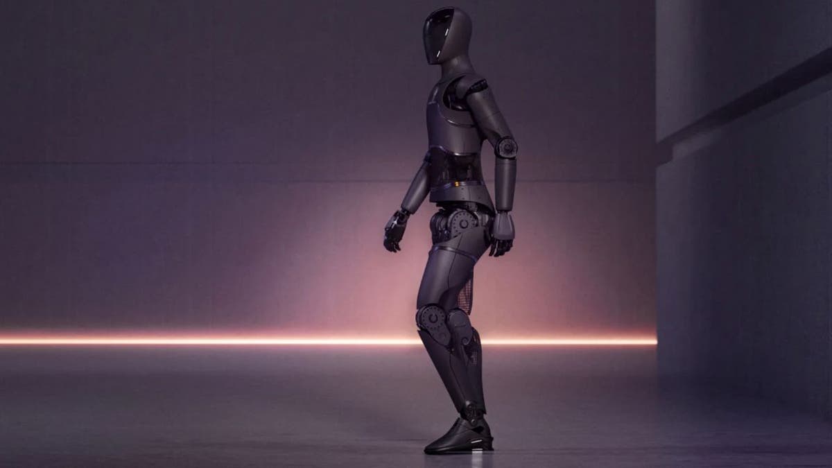 Humanoid robot walking from right to left.