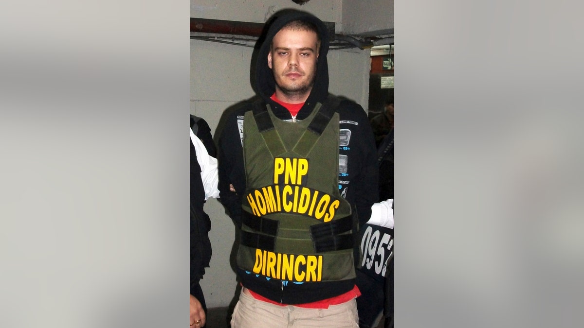 Joran Van der Sloot of the Netherlands is transferred by the police from the police headquarters to the prosecutor's office in Lima