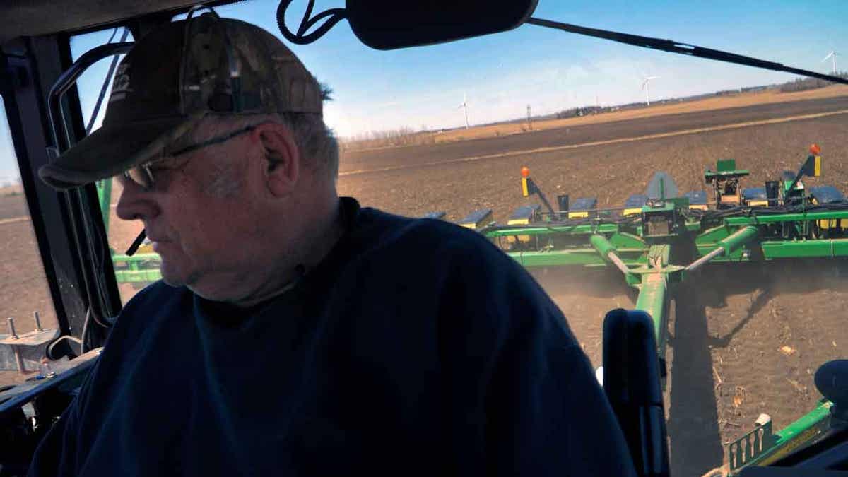 Crop farmer Bob Worth plants corn