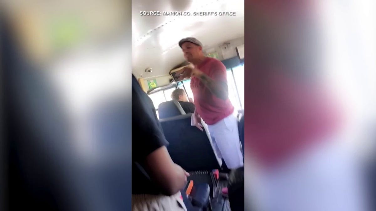 Parents seen on a bus allegedly hitting a school employee