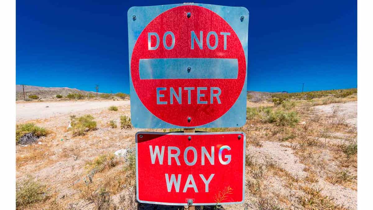 Bright Red sign warns drivers not to enter this lane of highway