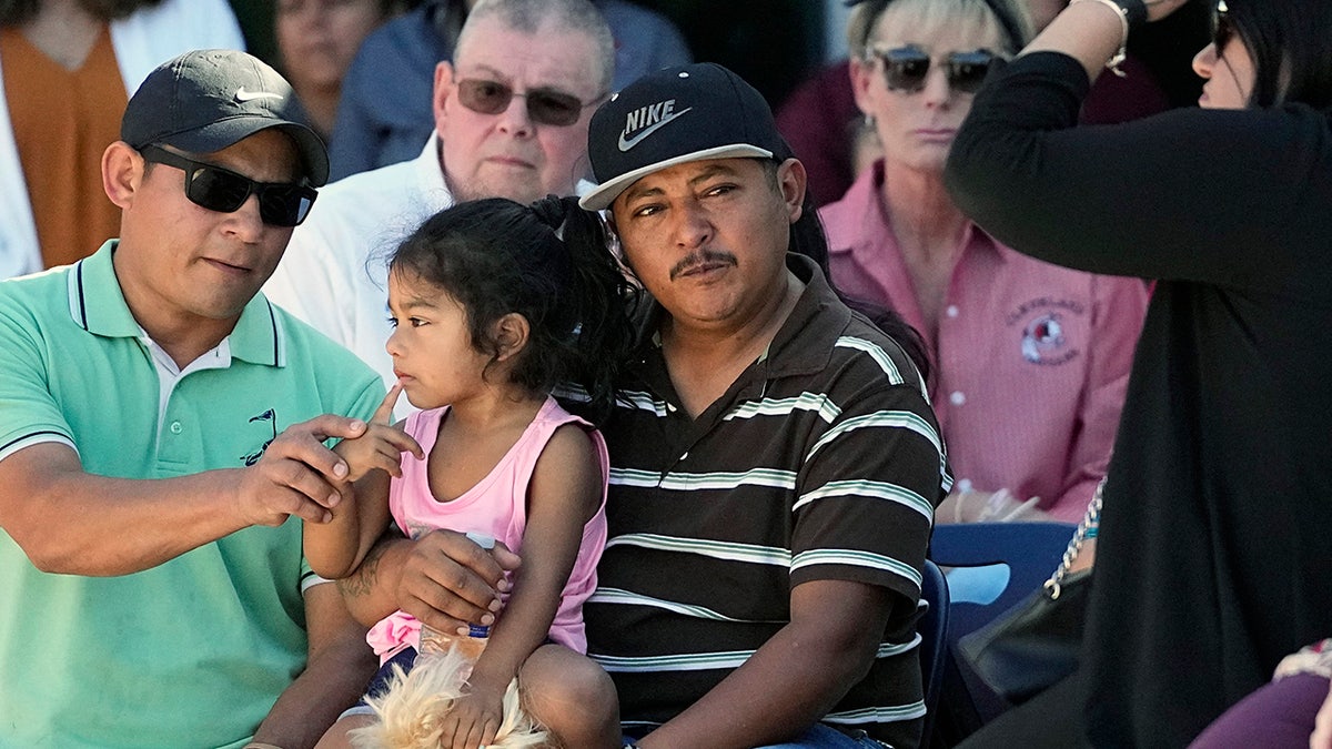 Cleveland, Texas, shooting survivor with daughter