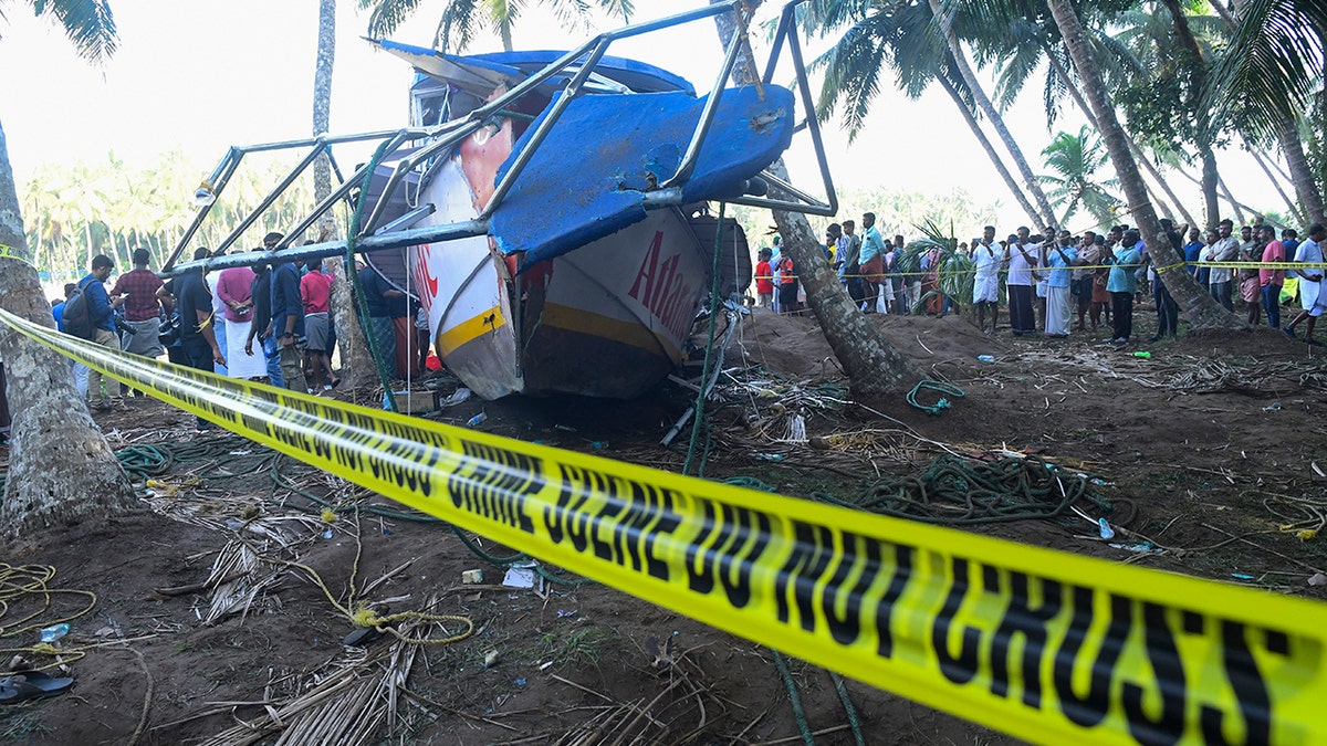 Caution tape in front of a capsized boat