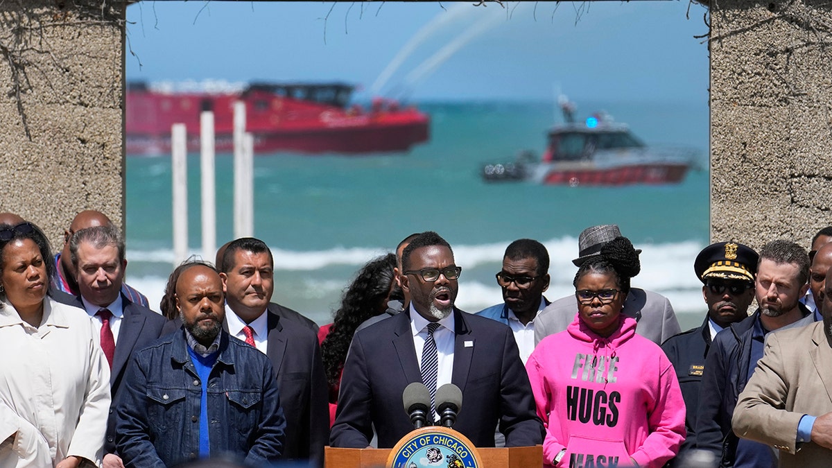 Chicago Mayor Brandon Johnson flanked by city officials