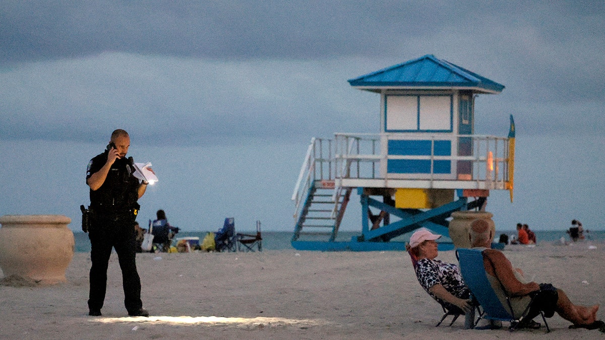 A police officer on the sand