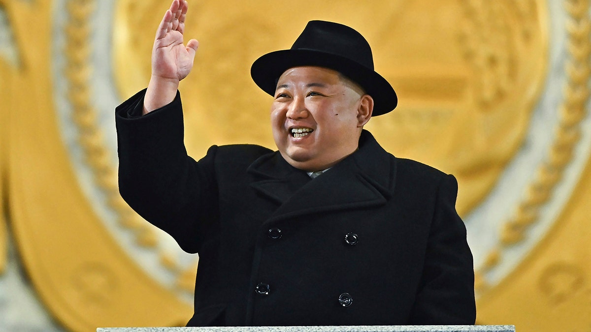 Kim waving