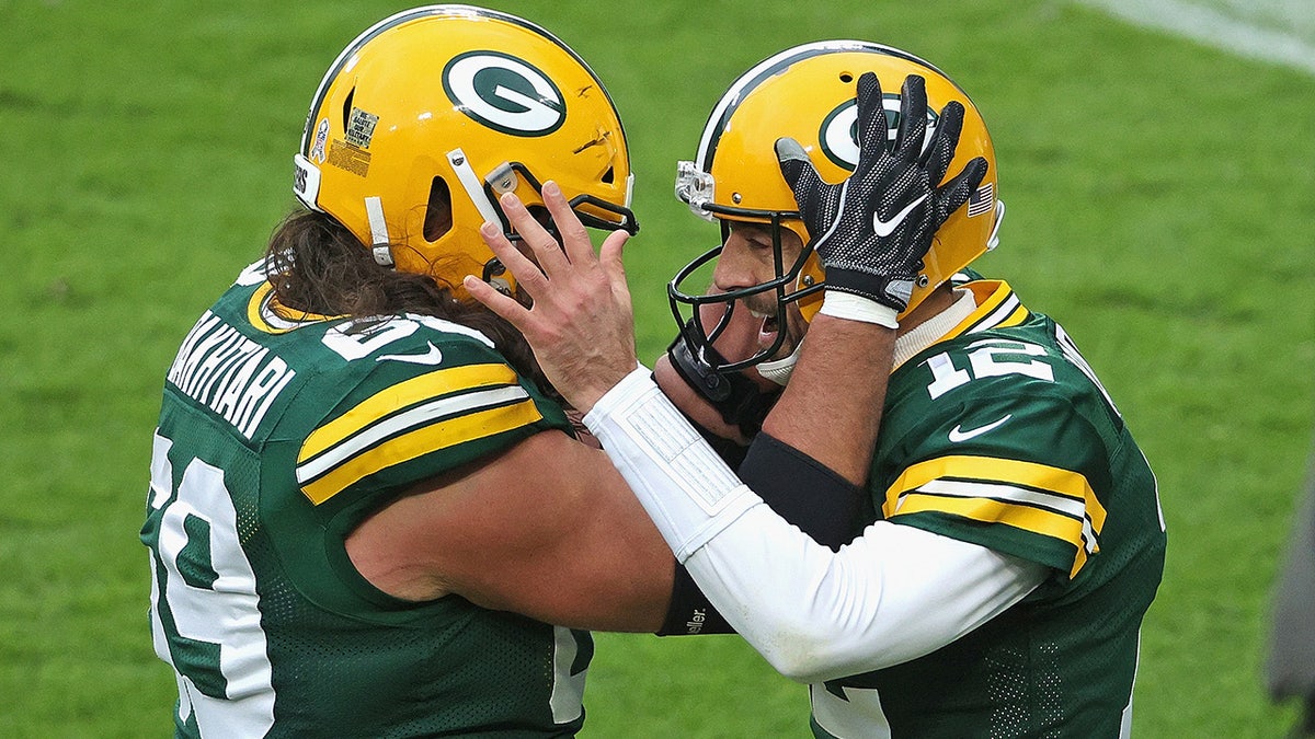 Aaron Rodgers celebrates with David Bakhtiari