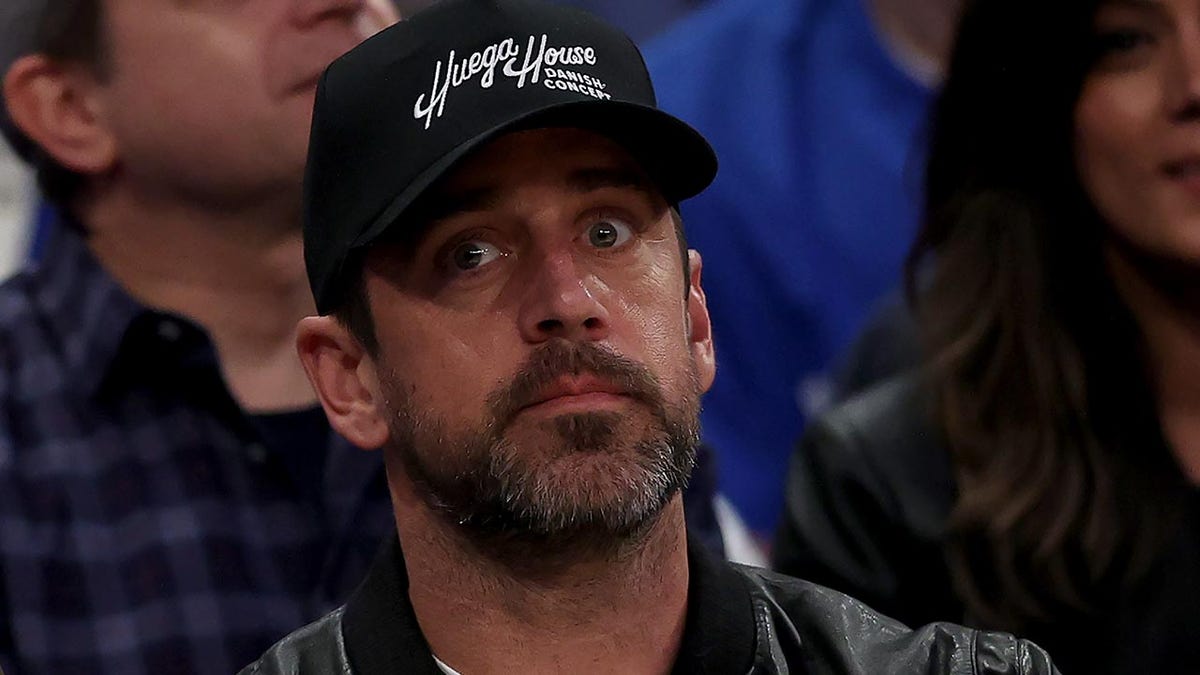 Aaron Rodgers takes in the Knicks game