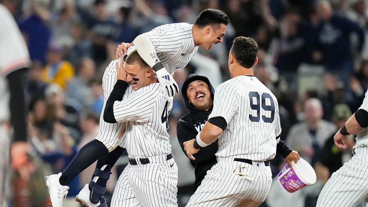 Yankees fans go nuts as squirrel scurries along fence