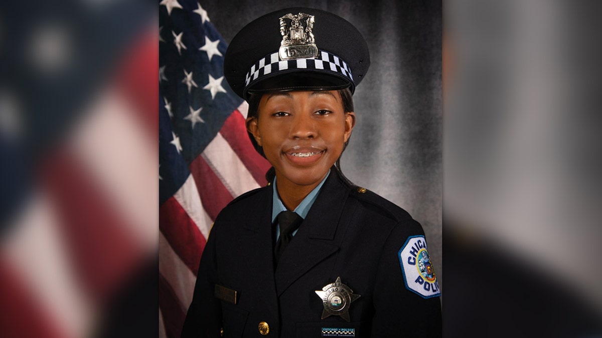 Areanah Preston in uniform in front of US flag