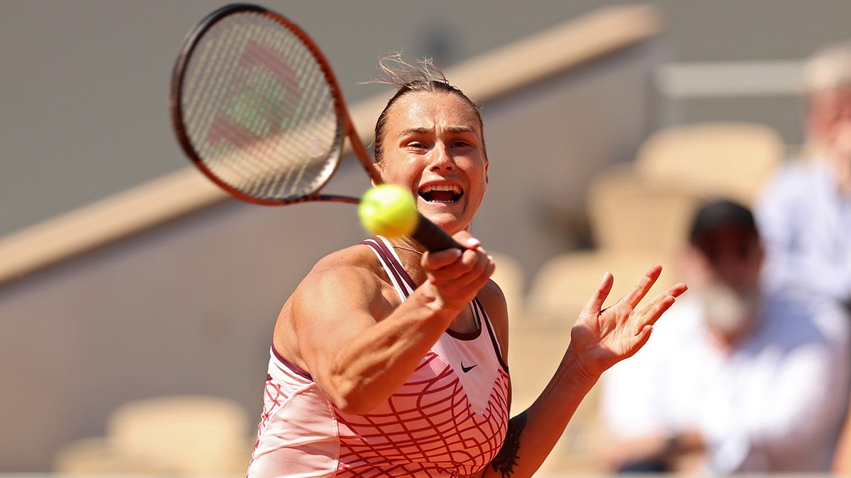 Aryna Sabalenka returns a shot