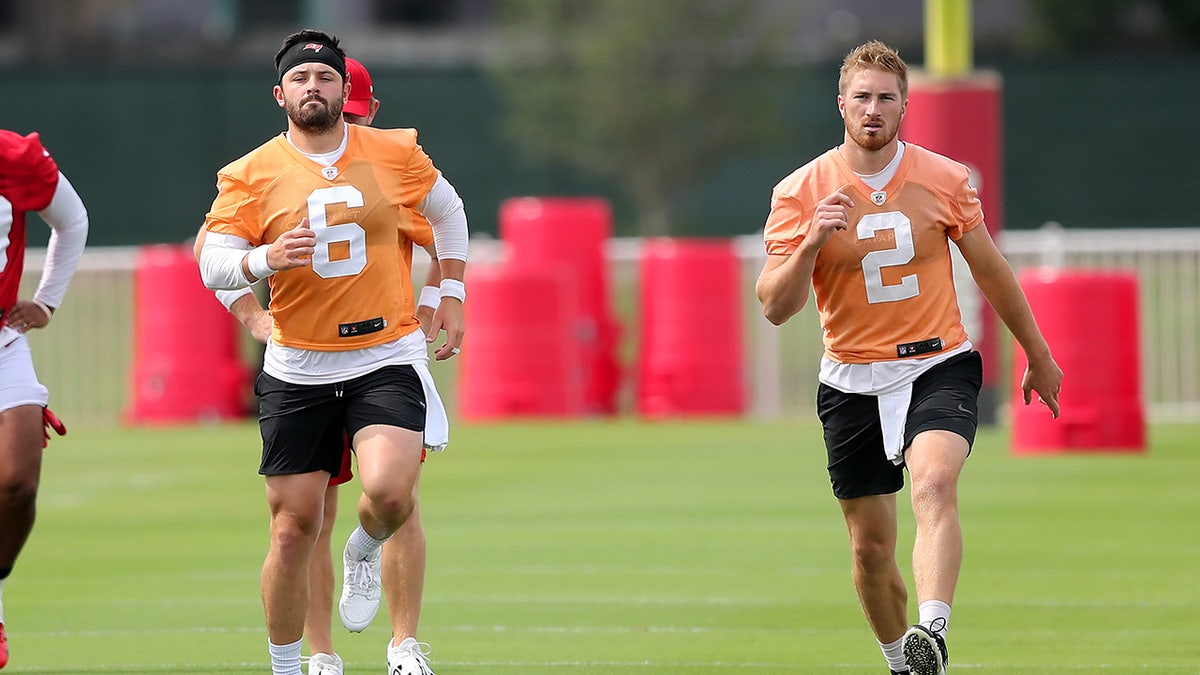 Tampa Bay Buccaneers quarterbacks throw during practice