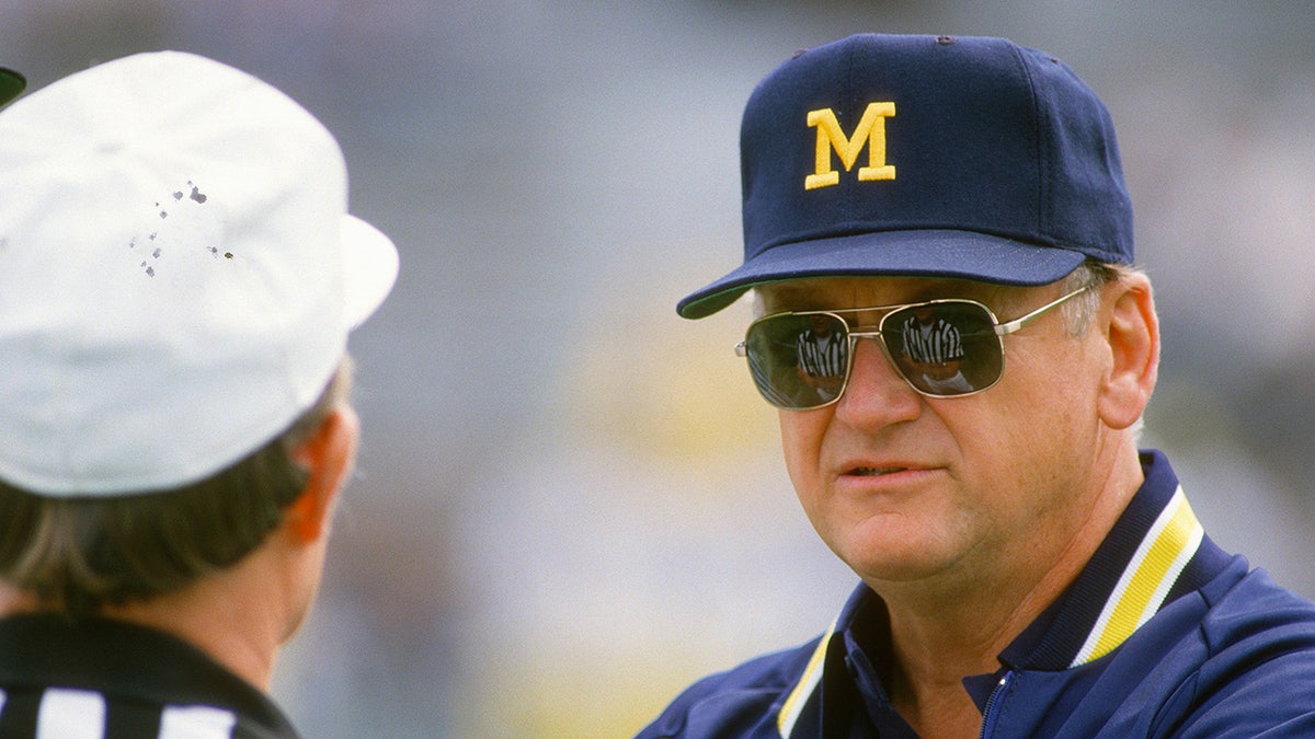 Bo Schembechler talks with a referee