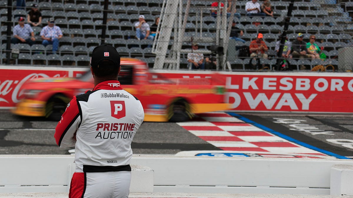 Bubba Wallace looks on