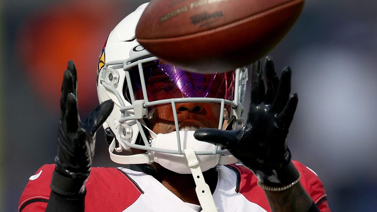 Budda Baker catches a ball