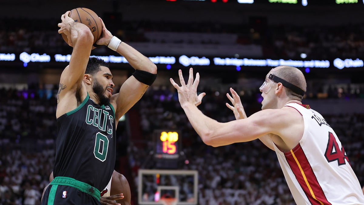 Boston Celtics forward Jayson Tatum (0) drives against Miami Heat forward Duncan  Robinson (55) during the first half of game two of the Eastern Conference  Finals for the 2023 NBA playoffs at