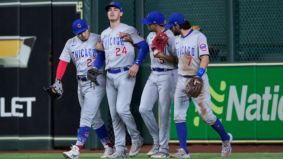 Seiya Suzuki attends to Cody Bellinger