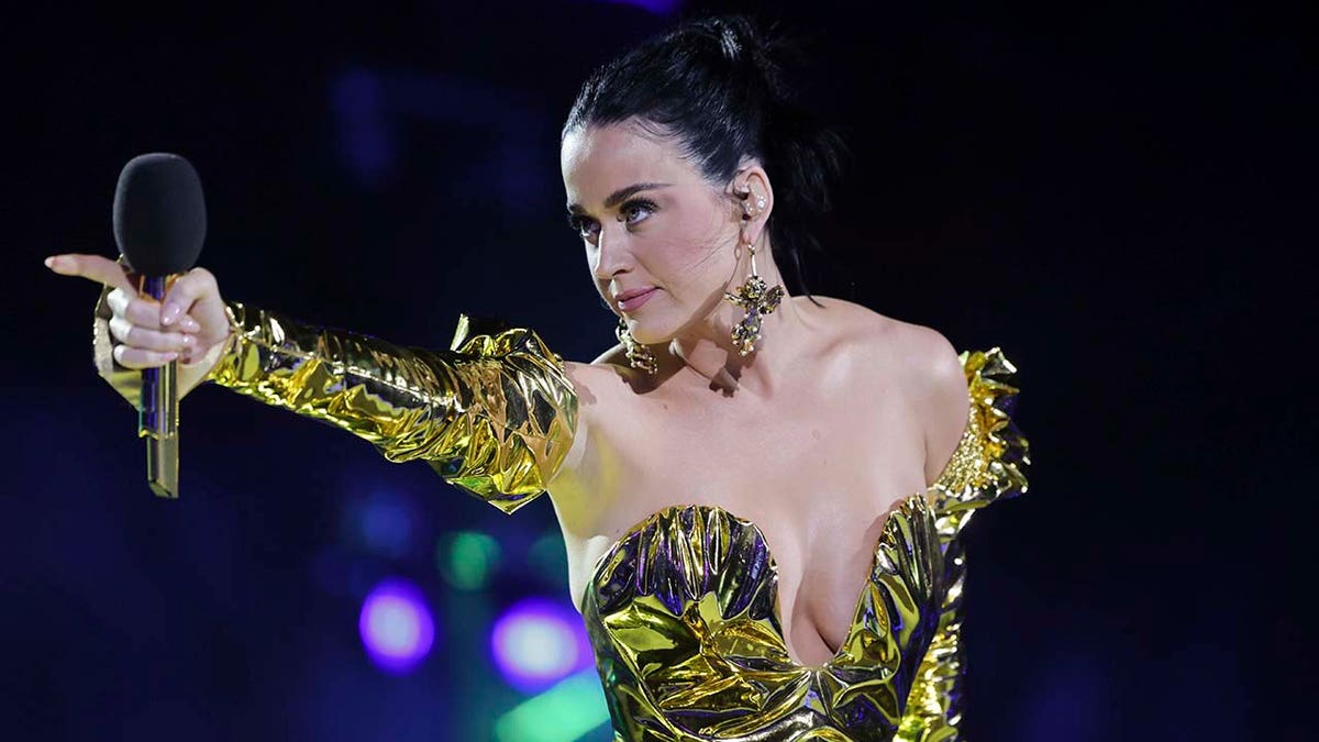Katy Perry wears gilded gown to perform at coronation concert