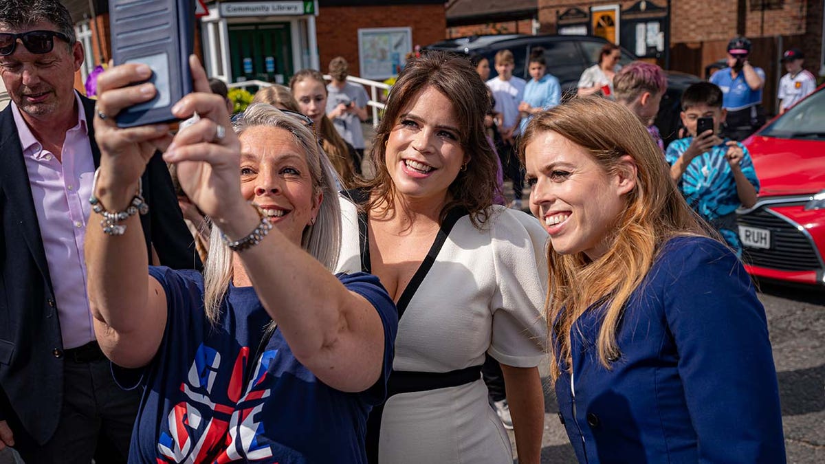 Princess Beatrice of York (L) and Princess Eugenie of York attend a Coronation Big Lunch in Chalfont St Giles, Buckinghamshire