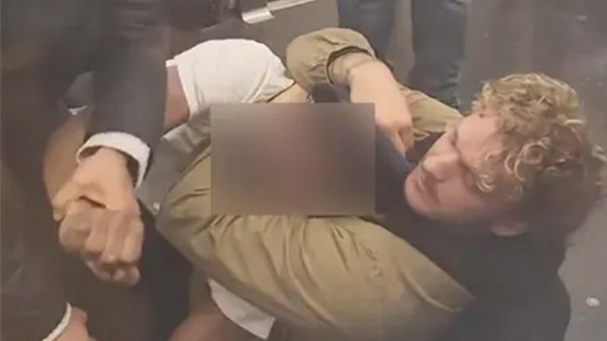 Marine veteran Daniel Penny shown holding Jordan Neely in a chokehold.