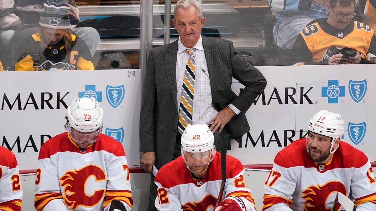 Darryl Sutter is behind the Flames' bench