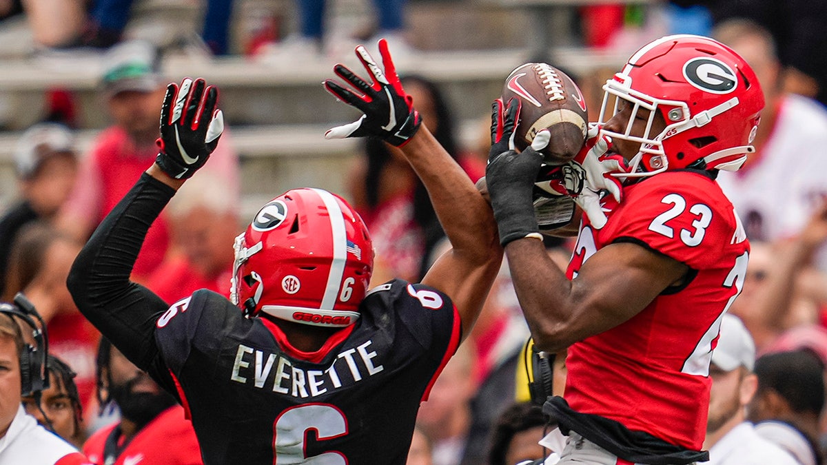 Apr 16, 2022; Athens, Georgia, USA; Georgia Bulldogs wide receiver De’Nylon Morrissette (23) tries to make a catch against defensive back Daylen Everette (6) during the Georgia Bulldogs Spring Game at Sanford Stadium.