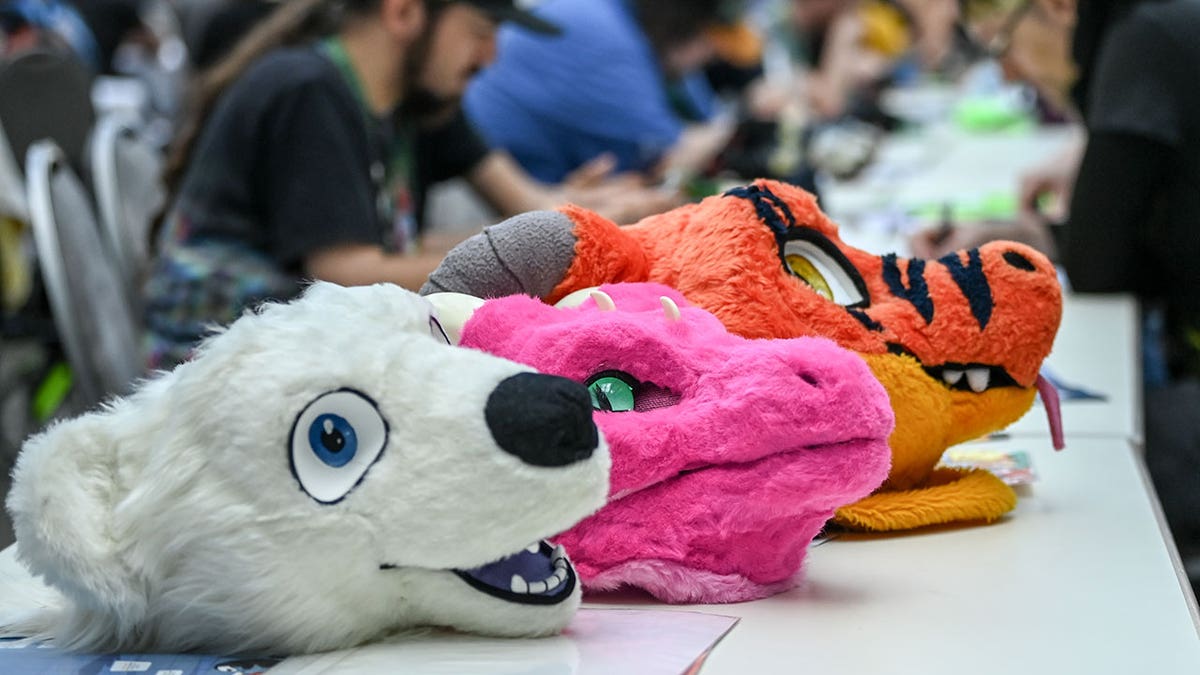 Furry heads displayed at a convention