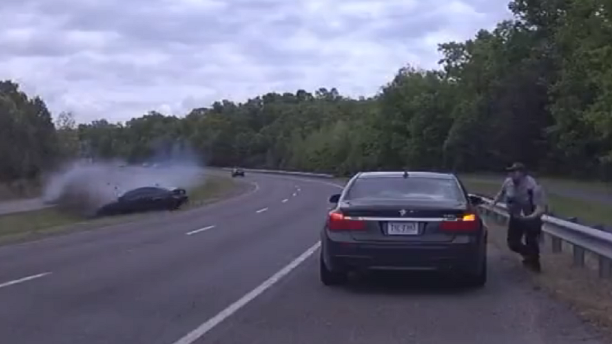 Virginia police officer runs for cover to avoid crash