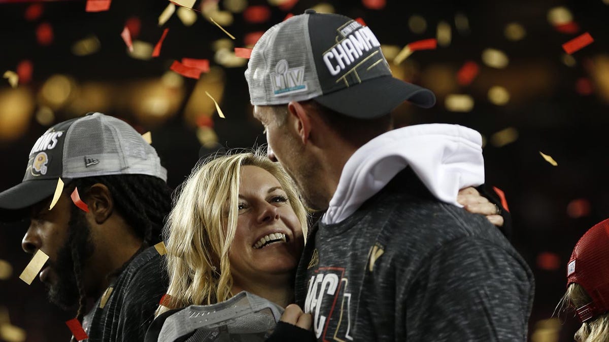 Kyle Shanahan celebrates the NFC Championship with his wife