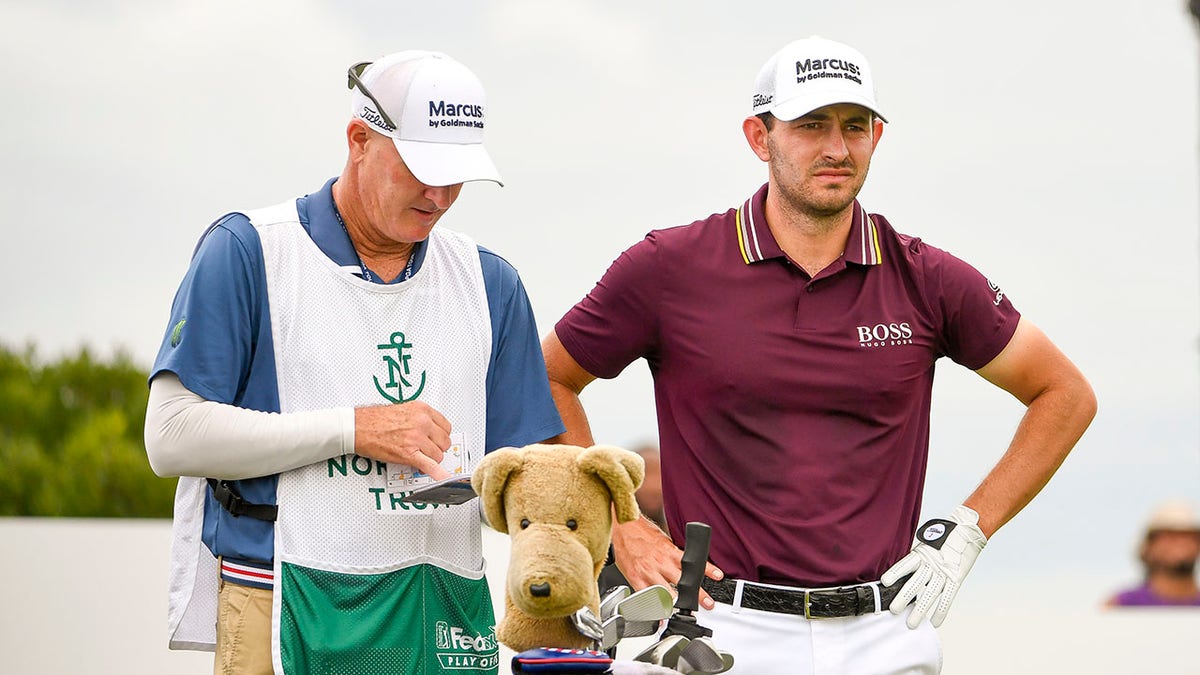 Patrick Cantlay consults with caddie Joe LaCava