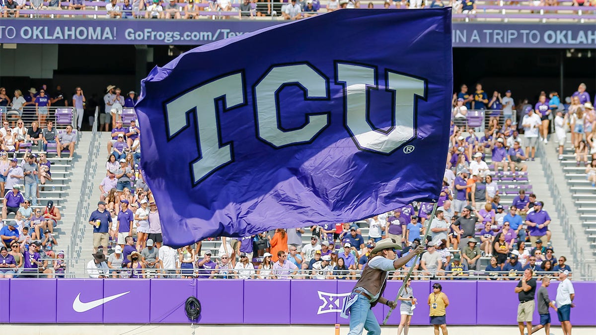 TCU Horned Frogs flies flag at a football gae