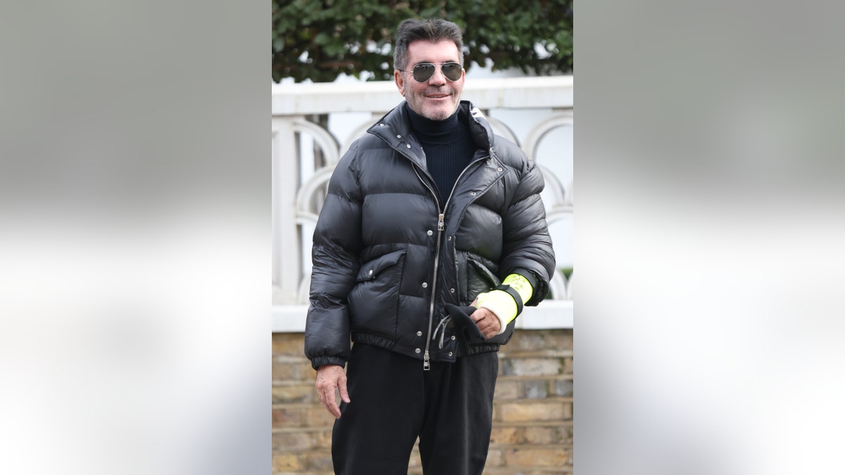 Simon Cowell broken arm