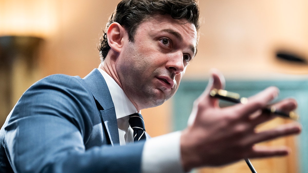 Jon Ossoff motioning with is hands