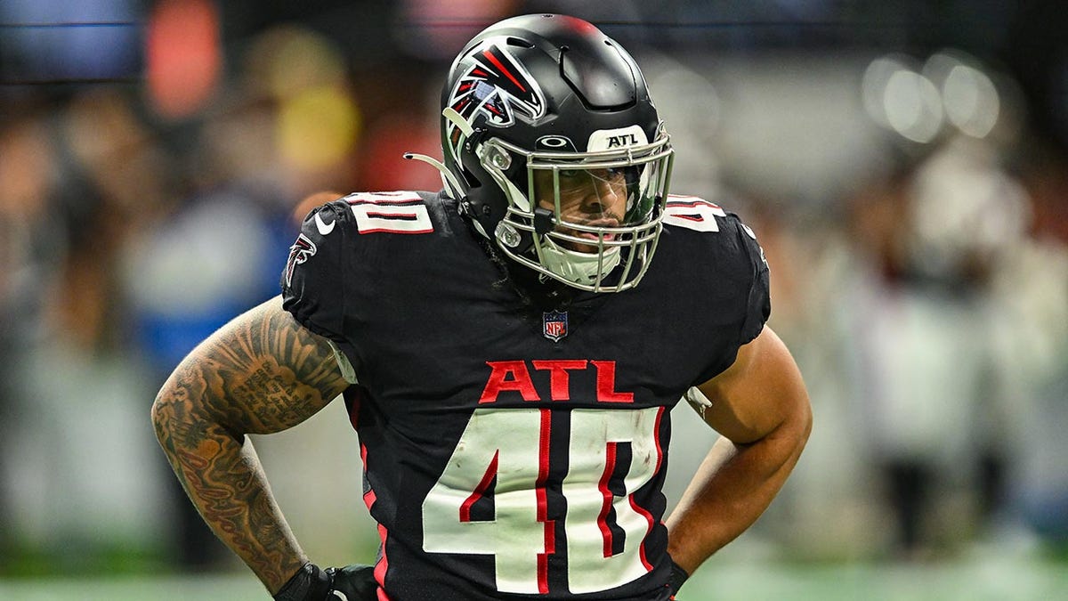Keith Smith warms up before a Falcons game