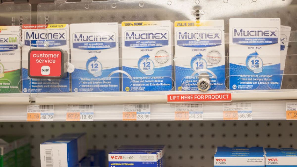 Mucinex behind case at pharmacy