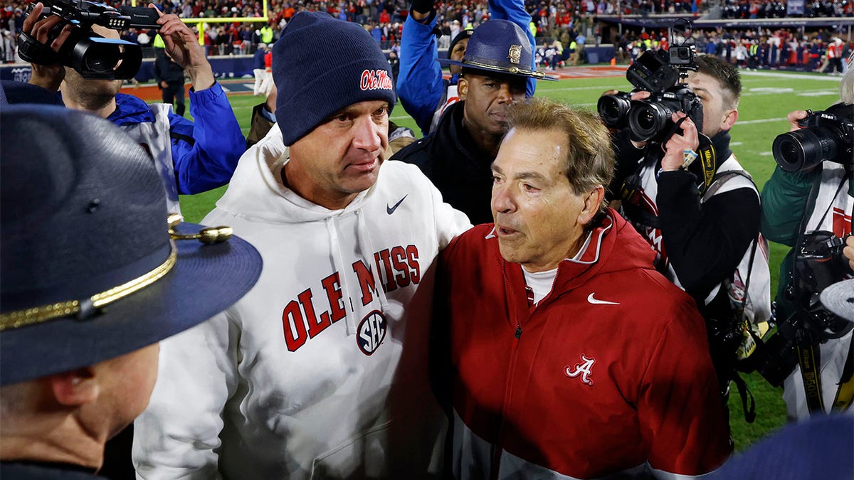 Nick Saban and Lane Kiffin meet after a game